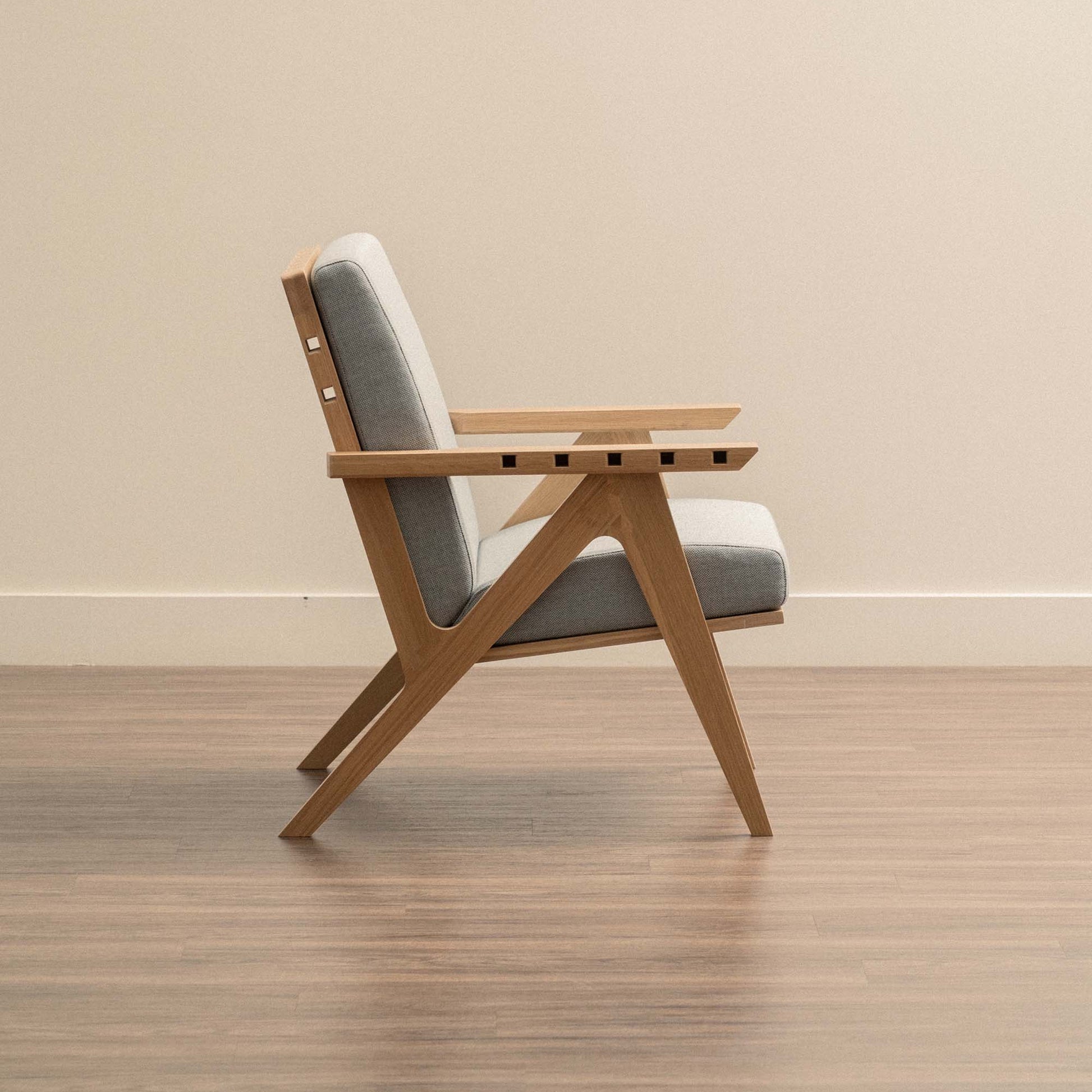 White Oak Envy chair frame with Mist Grey fabric side view